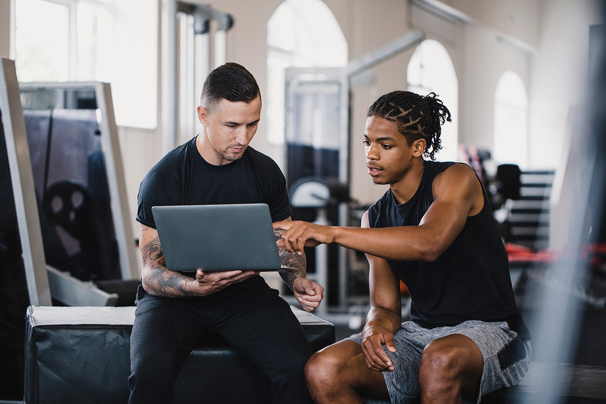Personal Trainer Consulting with a Athletes about Mental Health