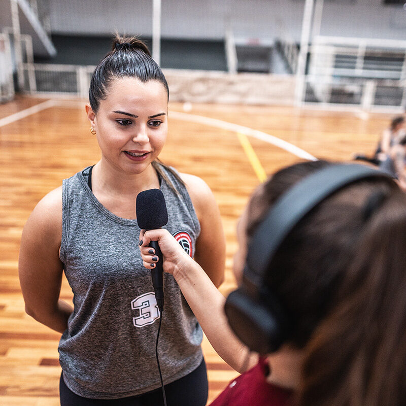 Young female volleyball player being interviewed